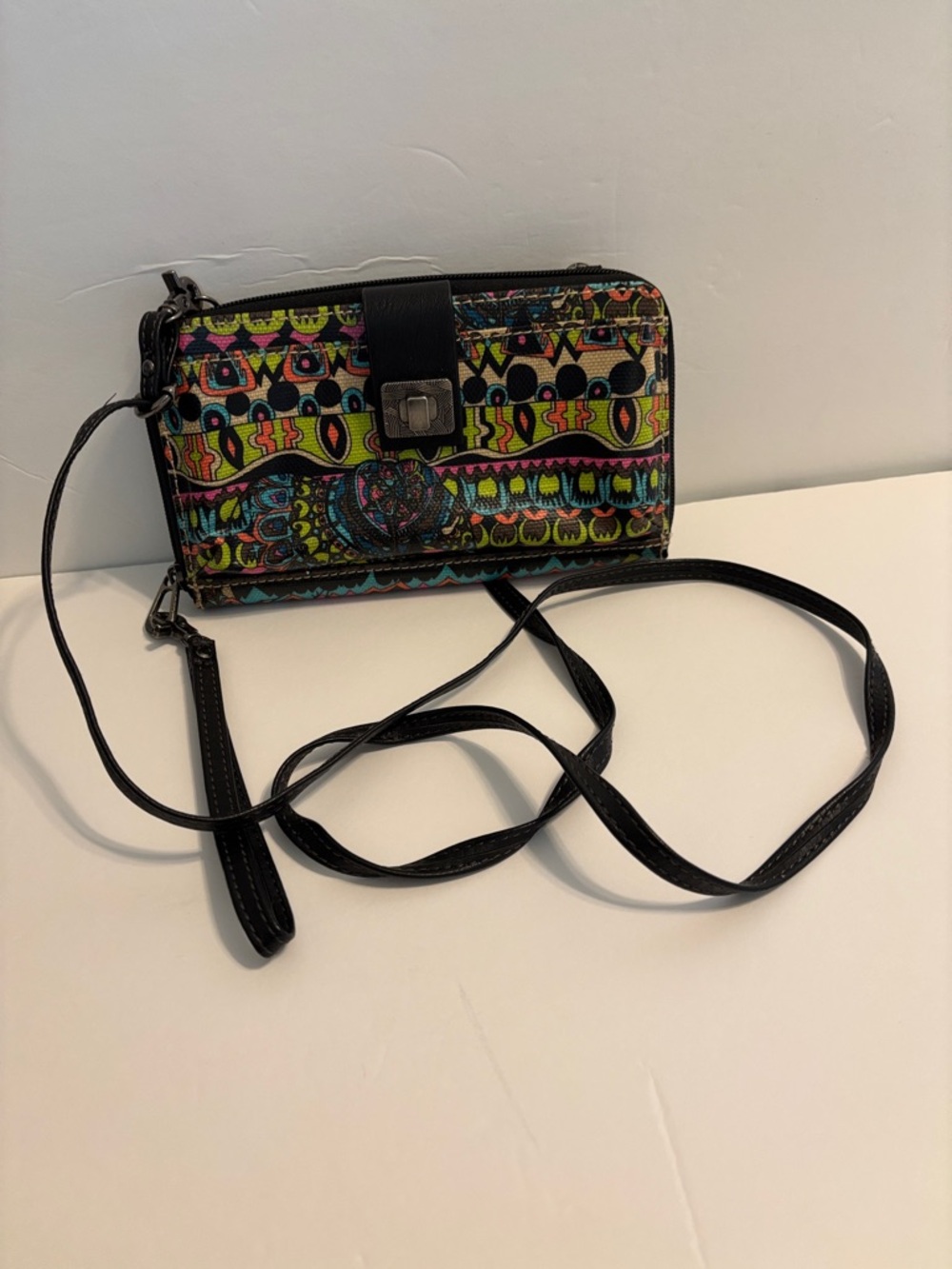 Sakroots colorful wallet with removable, shoulder strap, and wristlet strap